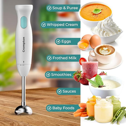 Crompton hand blender with images of food items it can be used for on a wooden surface.