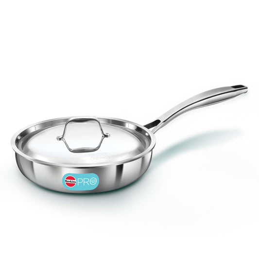 Stainless steel frying pan with lid on a white background