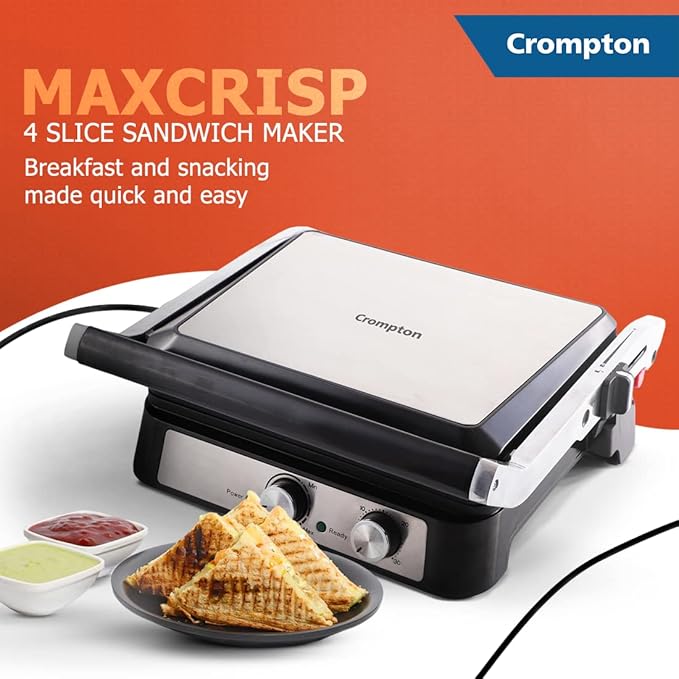 Crompton Maxcrisp 4 slice sandwich maker with a plate of sandwiches and condiments on a white background.